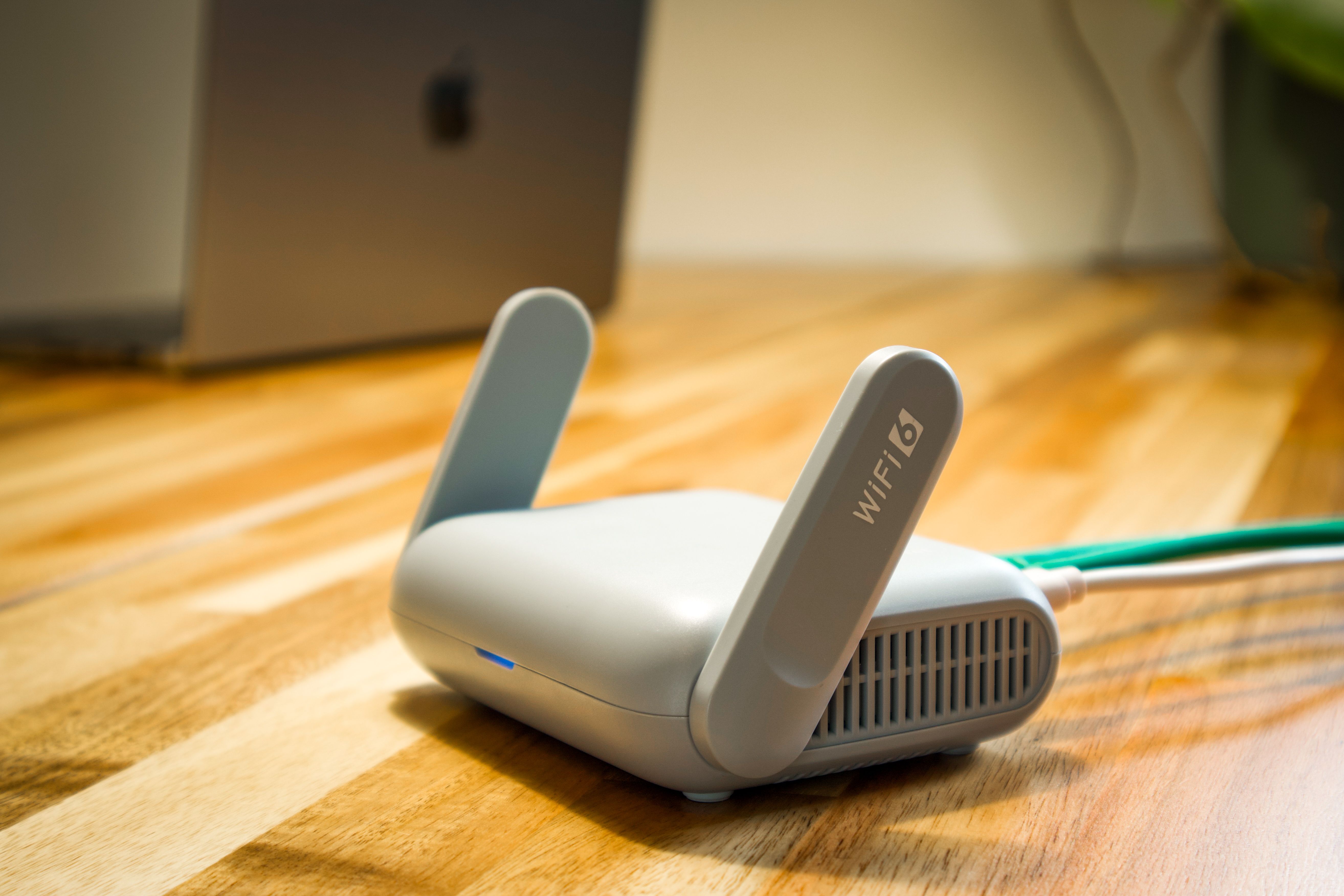 Modern WiFi 6 router on desk for network optimization