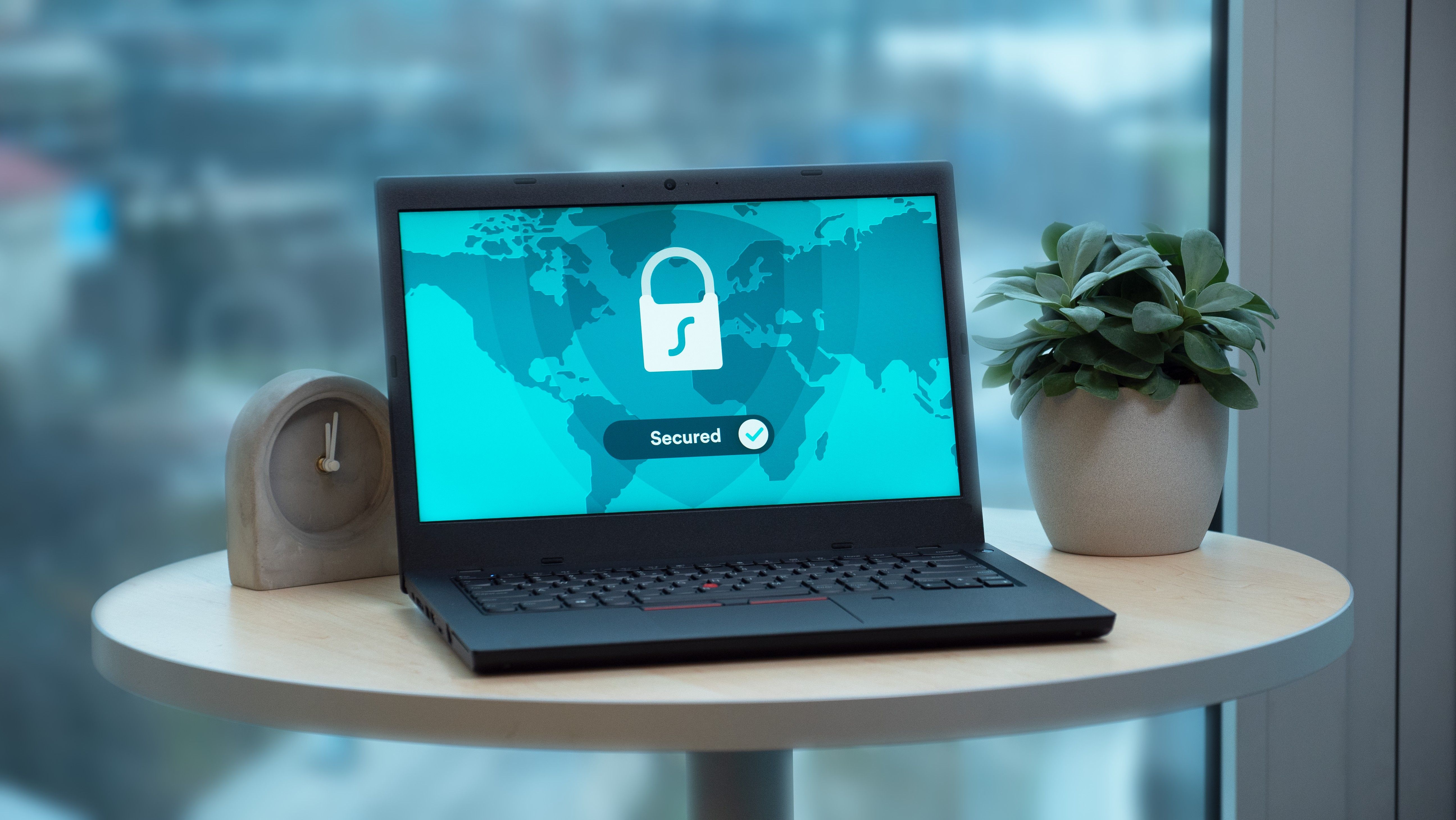 Laptop displaying security lock for VPN encryption